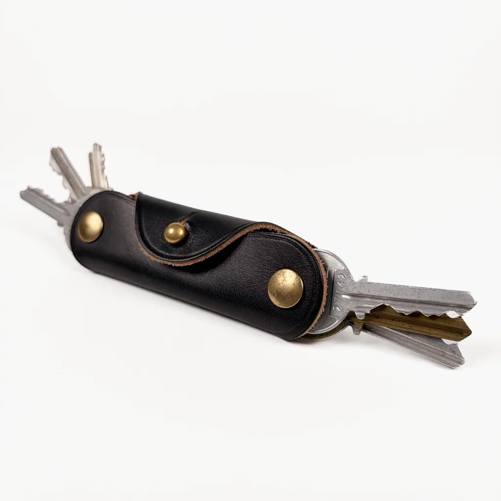 Black Bridle Swiss Knife Key Case - handmade Wickett & Craig leather, with the keys fanned out